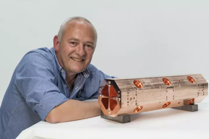 Serge Mathot with the first of the four modules that will make up the miniature accelerator