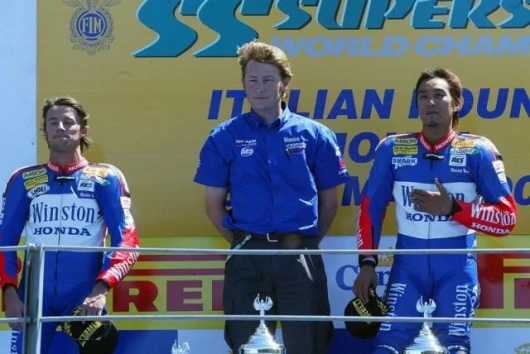 Gerrit ten Kate stands with his two charges on the podium - ten Kate builds the world's fastest supersport machines by a fair margin