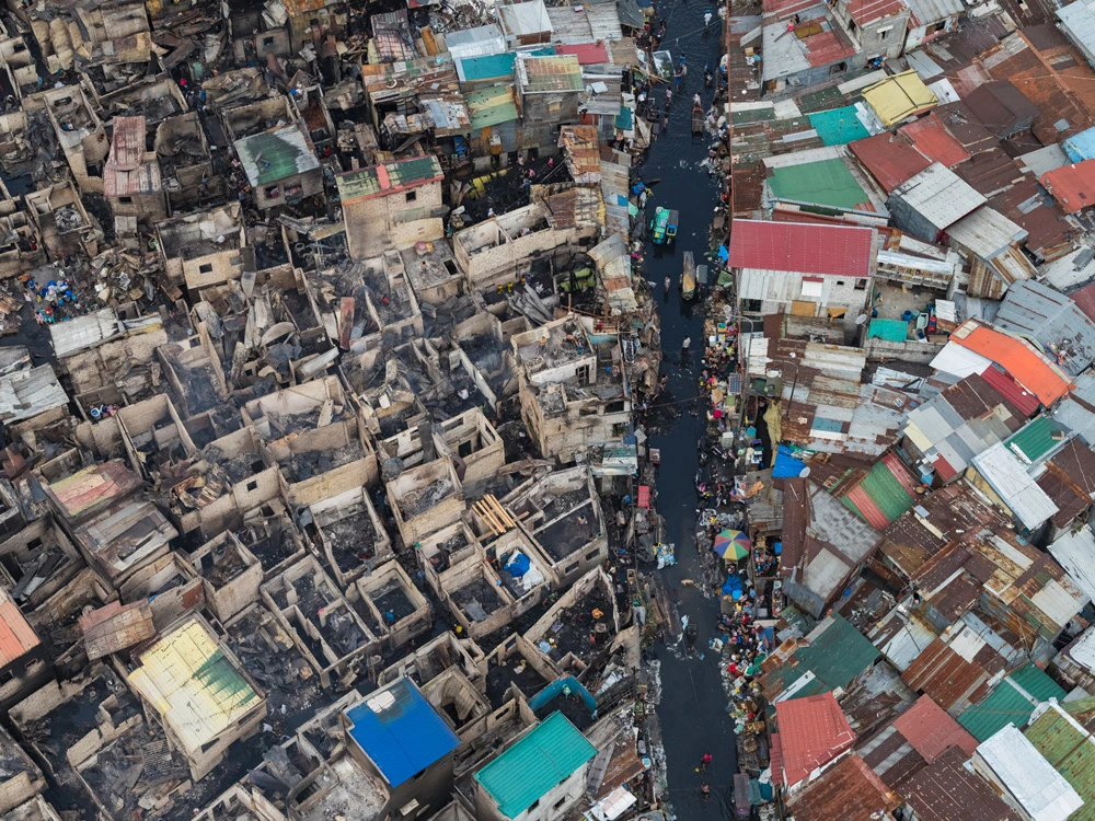 The day after a fire spread through Tondo, one of the most densely populated parts of Manila