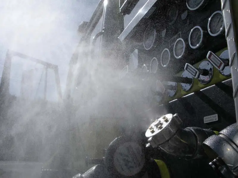 The HeatSeeker is a cooling mister that replaces the existing hose port cap on a fire truck