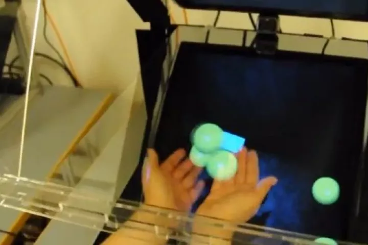 The Sensors and Devices group at Microsoft Research has developed a new system called HoloDesk that allows users to pick up, move and even shoot virtual 3D objects