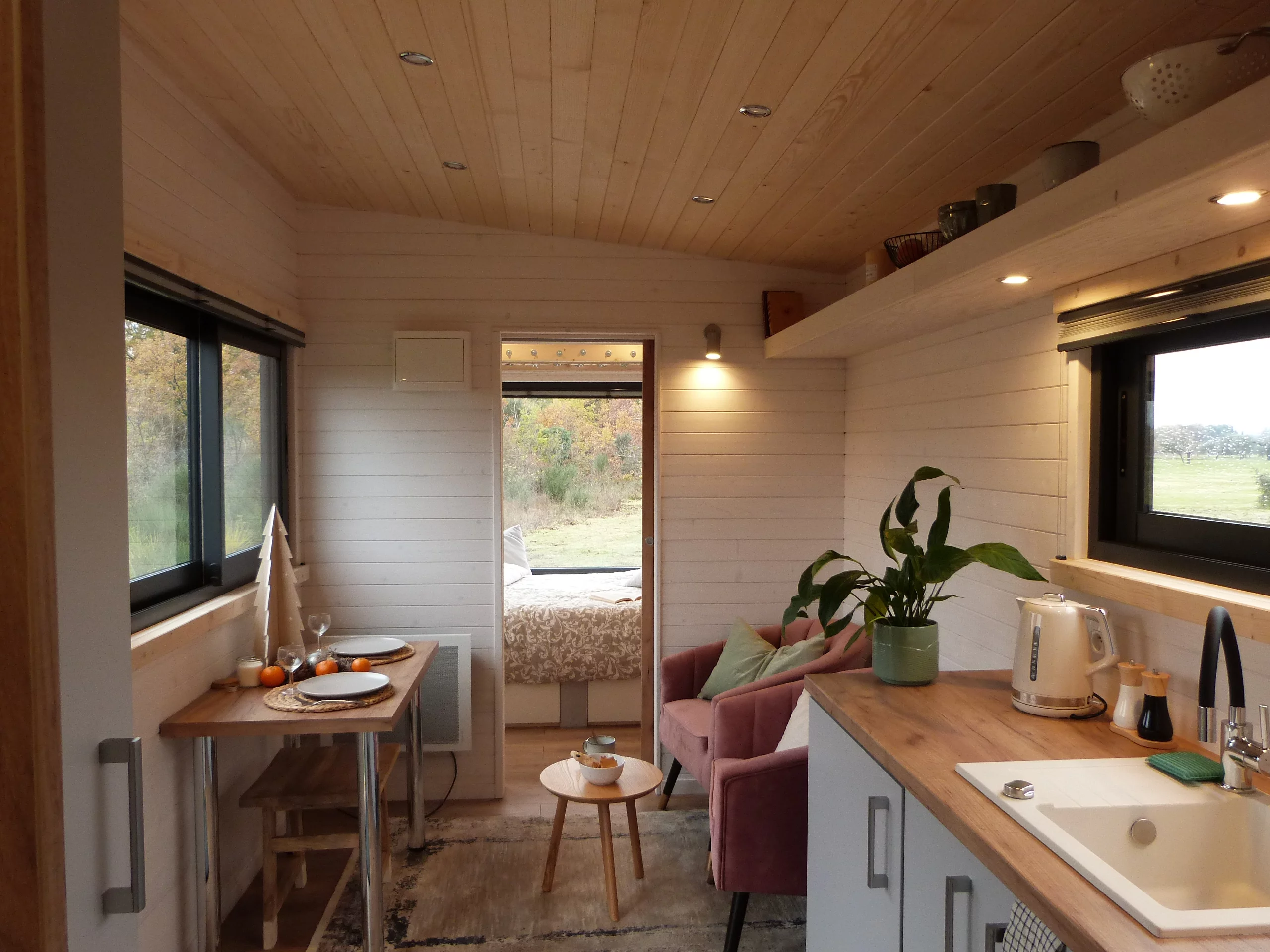 The Capucine's kitchen has a sink, an induction cooktop, and a small fridge