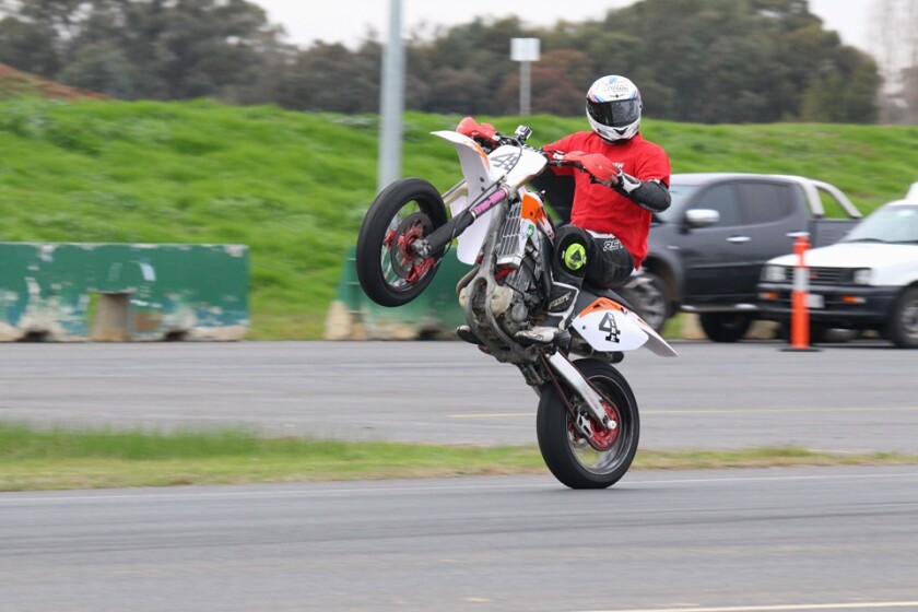 Chas Hern pops a wheelie for the camera.