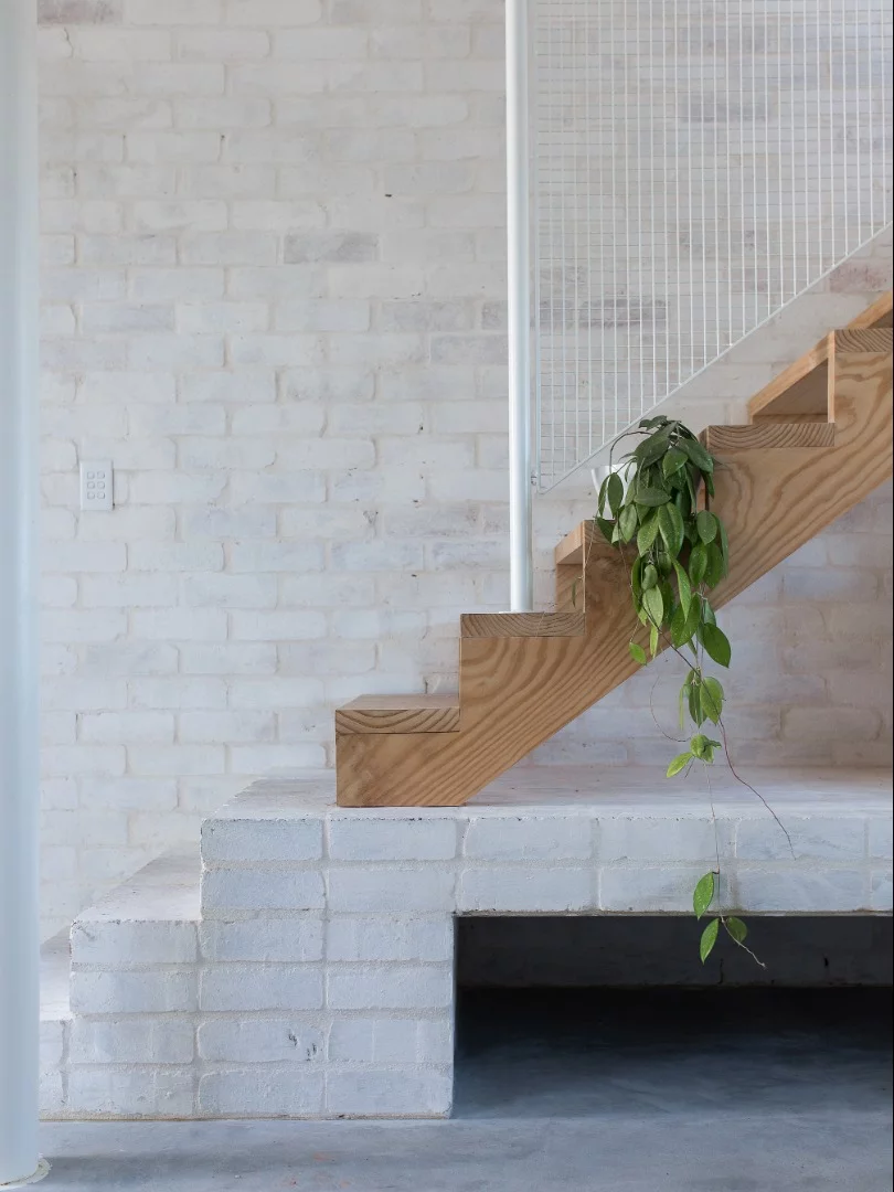 Minimalistic staircase leads to the master bedroom