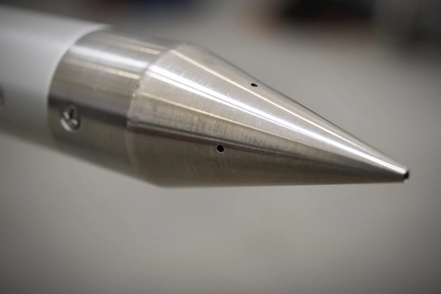 This close-up of a shock-sensing cone shows the ports through which the device will measure air pressure changes during supersonic flight