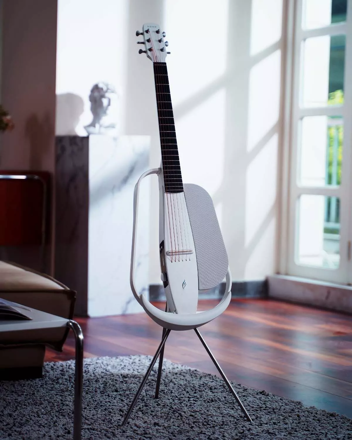 The Nexg smart guitar can be optioned with a charging stand for topping up the built-in battery
