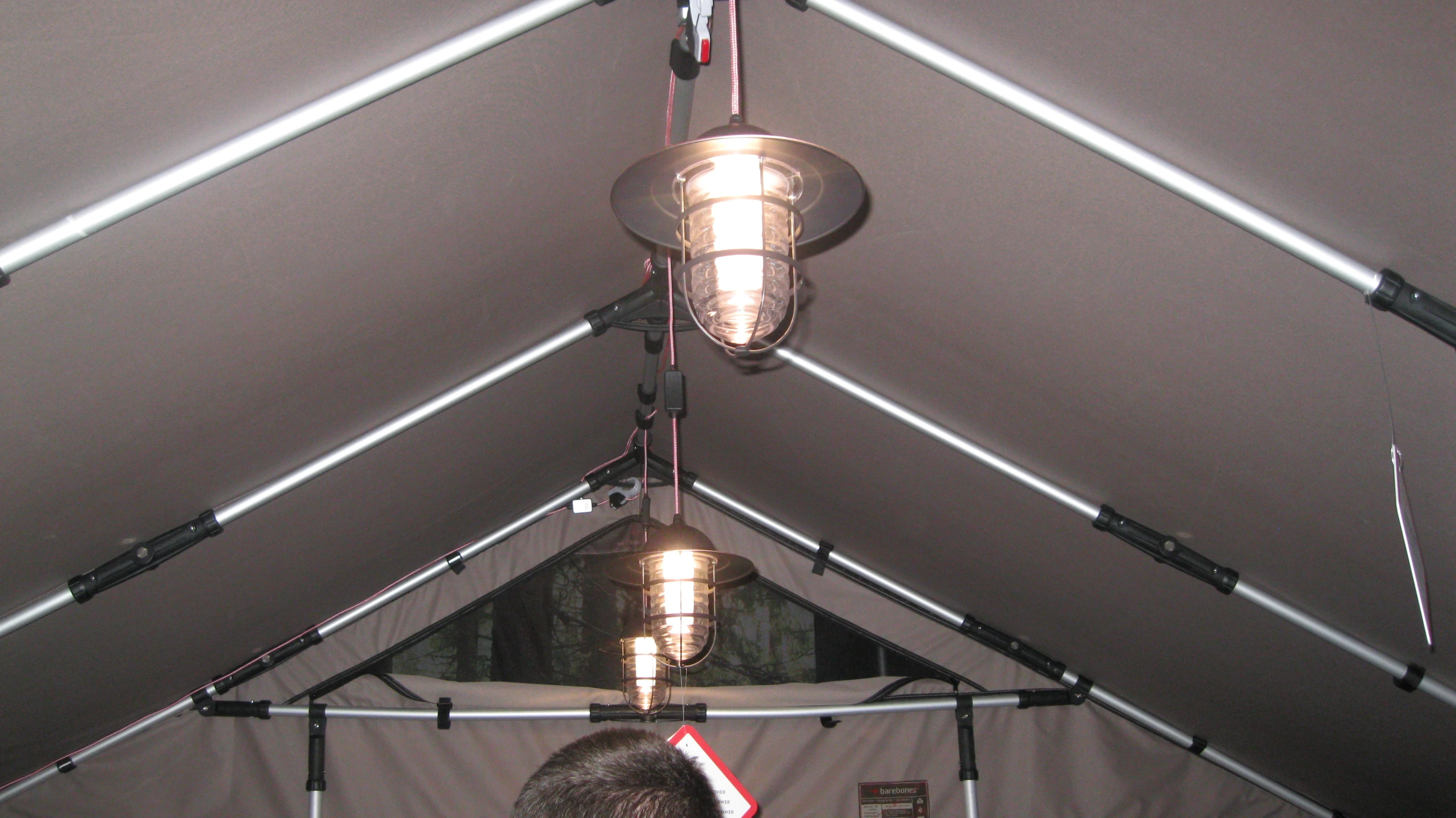 Lanterns hanging from the roof of the Barebones Safari Tent