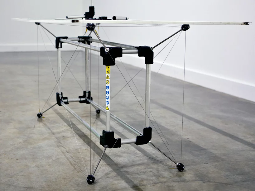 The table is made from discarded whipper snipper shafts and a glass shower screen