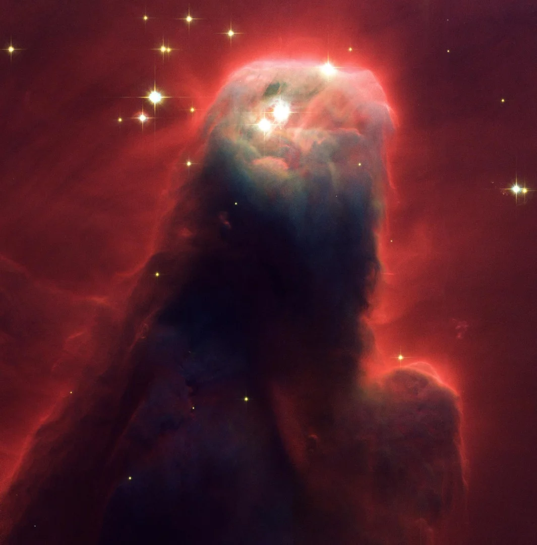 The upper section of the Cone Nebula, a huge pillar of dust that is constantly giving birth to new stars.