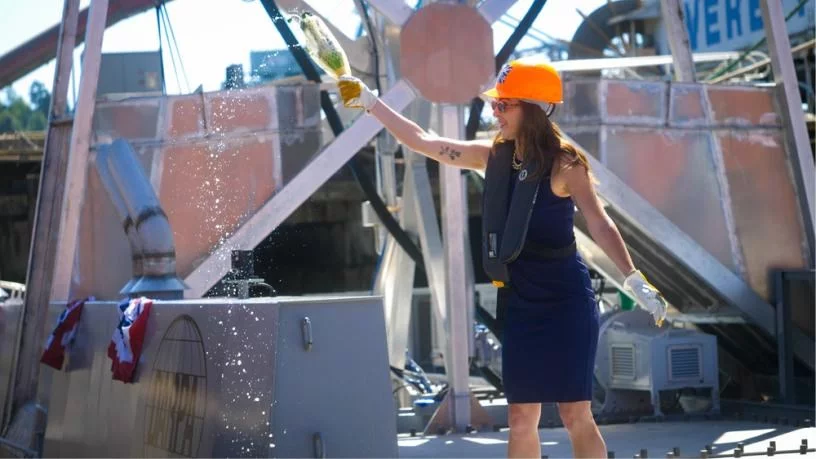 Ship sponsor Mattie Hanley christening Defiant