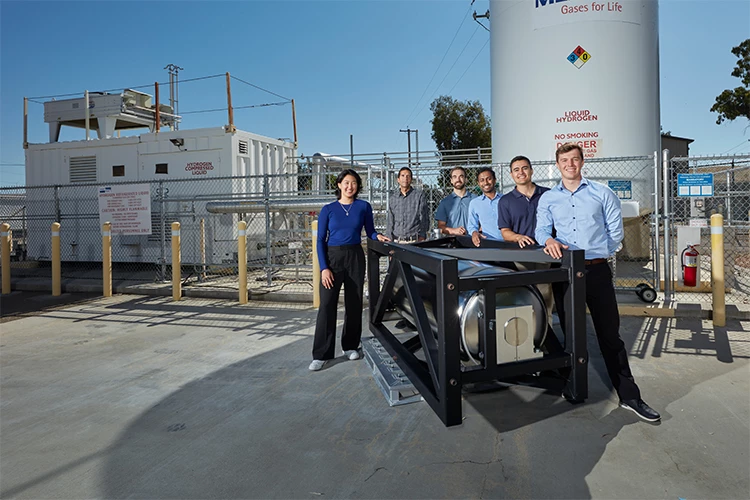 LLNL and Verne representatives with Verne's CcH2 storage system, scaled for use on semi trucks