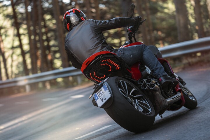 The V4 will be instantly recognizable by its silly four-pipe exhaust and that wonderful taillight arrangement