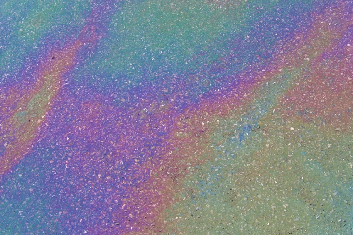 An all too common sight - the car park oil sheen rainbow (Photo: crabchick via flickr)