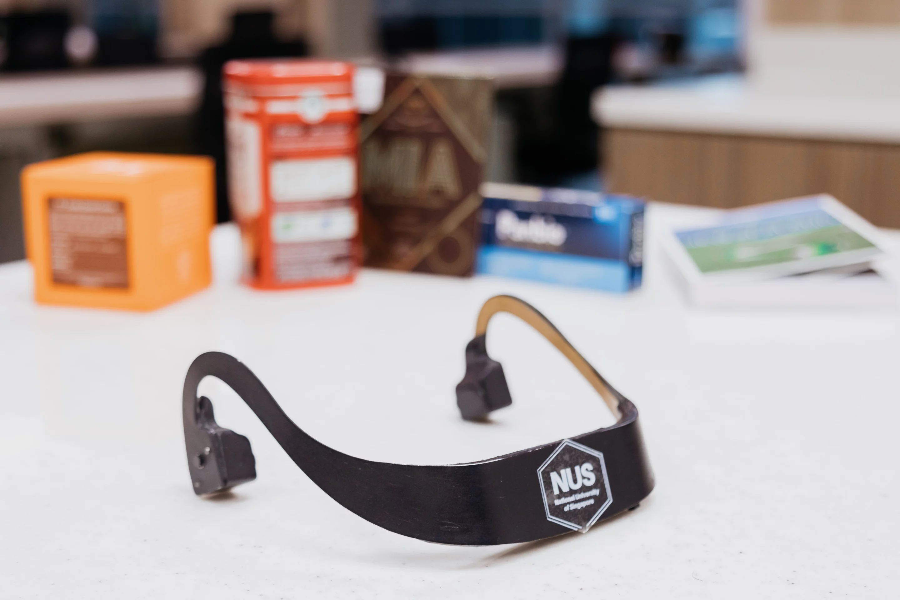 The AiSee headset alongside some of the products that it's currently able to identify