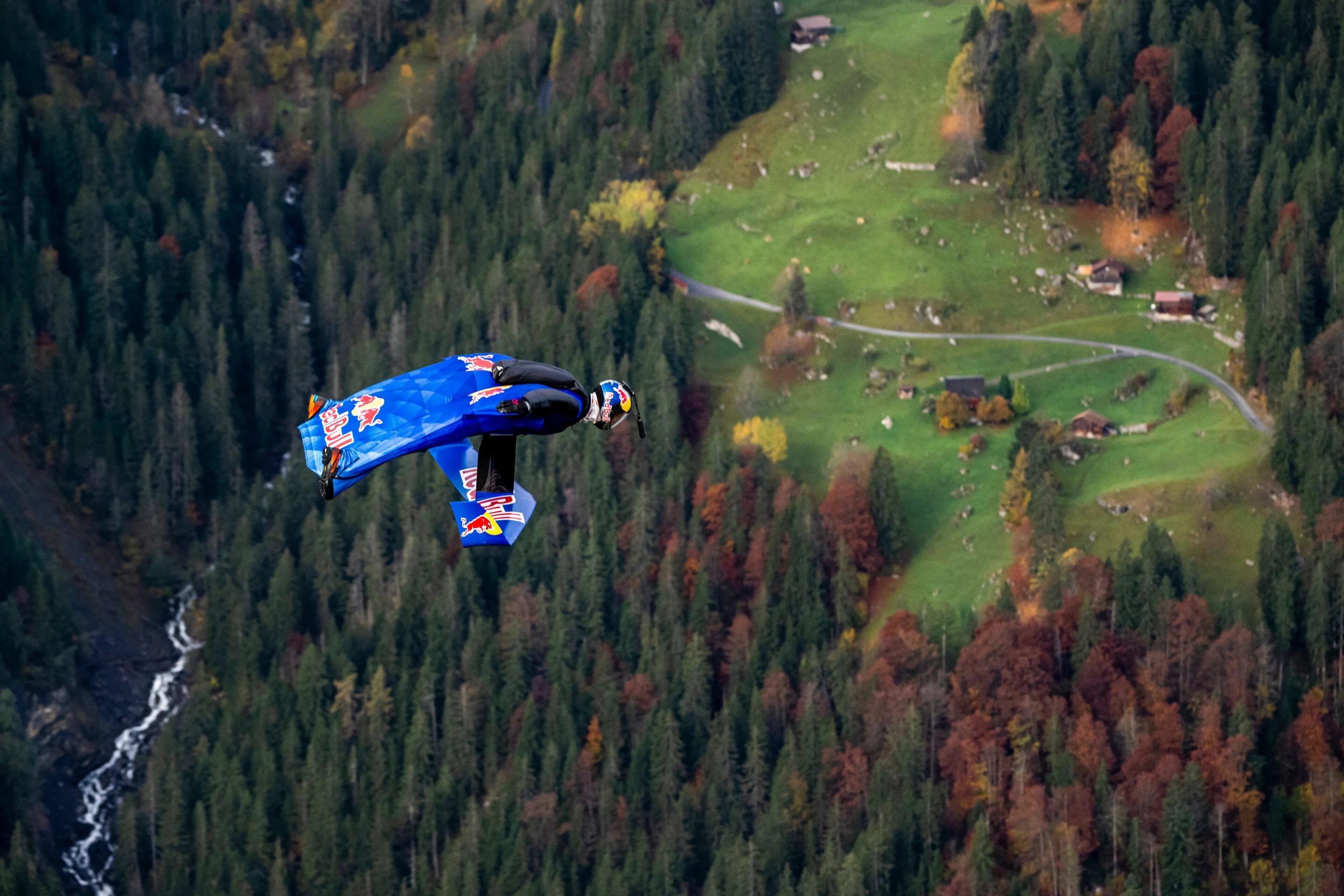 The evergreenery and fall foliage of Lauterbrunnen comes into clearer view