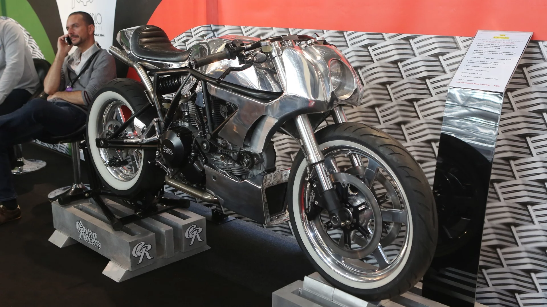 The latest masterpiece from Crazy Racers was on the Virginio Ferrari Racing stand at Top Marques, and like the Brough Superior above, it was one of those bikes you really wanted to crawl all over and examine every part for its design and function and sheer beauty. The company has already won a World Championship for its custom bikes, and this featherweight Ducati 1100 represents 2,700 hours of craftsmanship and untold expense with a 6.5 kg frame in 25 CD4S aeronautical steel, custom brakes by Beringer, custom aluminum wheels, custom shock by EMC, custom Avon tires, all topped off by a seat, tank and cowl crafted in aluminum 1050. The motor too has very few original bits with a smattering of Fast by Ferracci parts and reworked and lightened everything. Even the switchgear was handmade. A truly awesome fabrication.