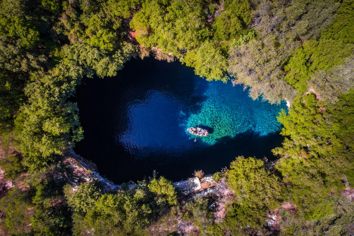 This shot shows Melissani Cave on the Greek island of Kefalonia from above