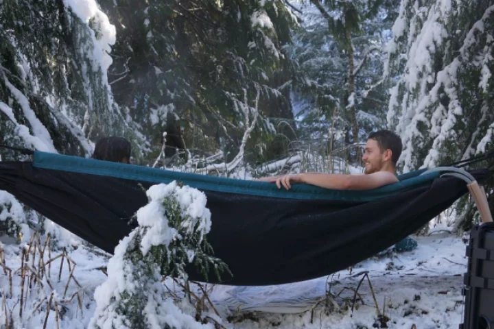 The HydroHammock serves as a portable hot tub for outdoor relaxation