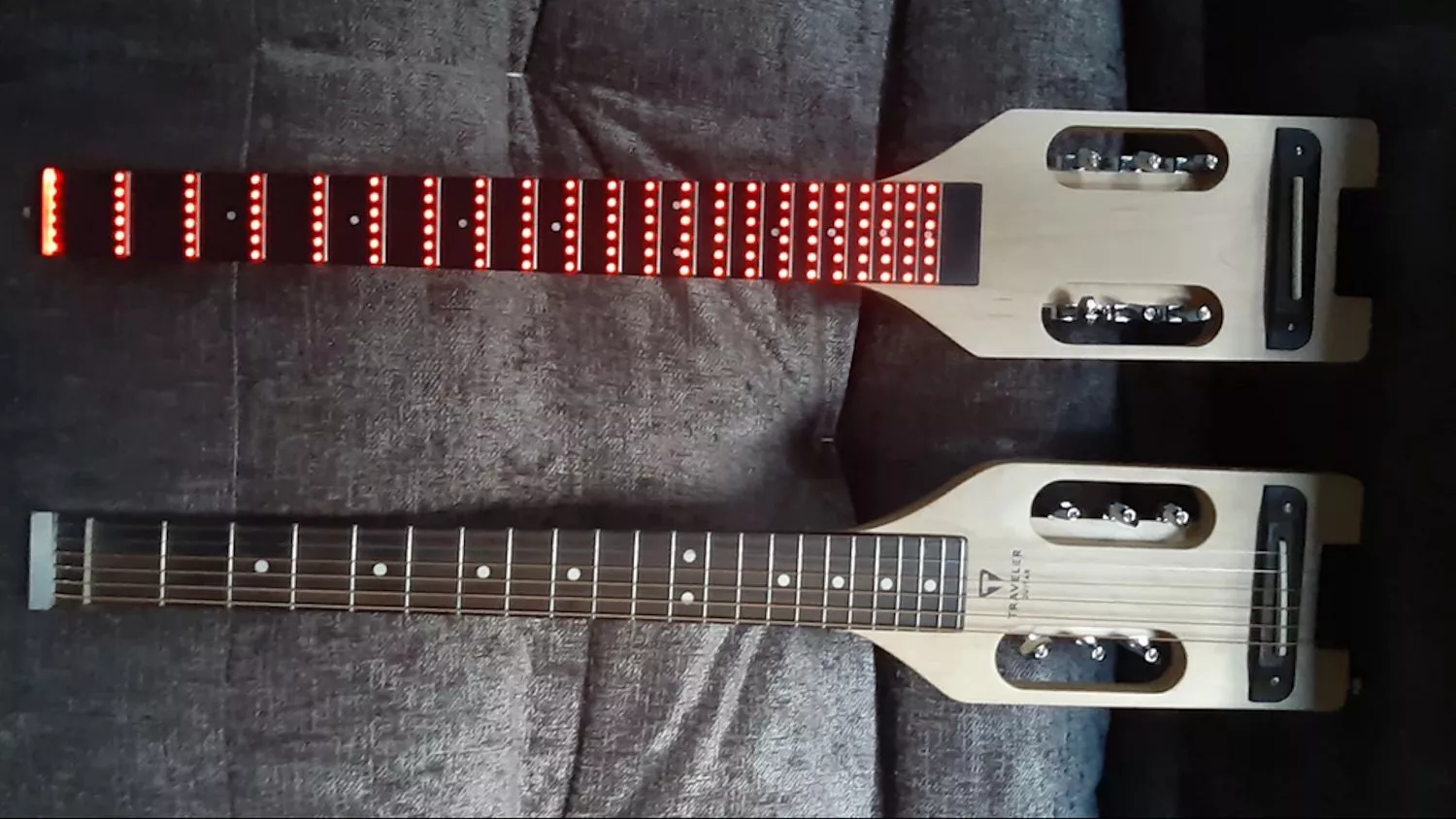 The Traveler Ultra-Light (bottom) and the Fretlight Traveler (top)