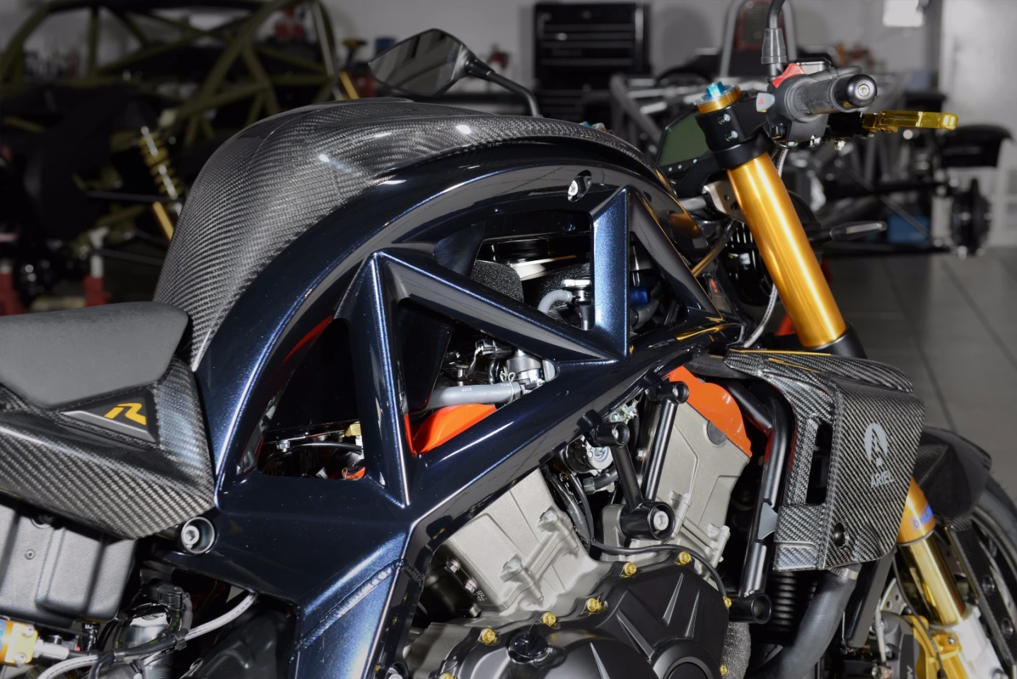 The carbon parts are also available for any other Ace version, but the black pearl-anodized frame and the red cylinder head covers suggest this is a rare 201-hp Ariel Ace R