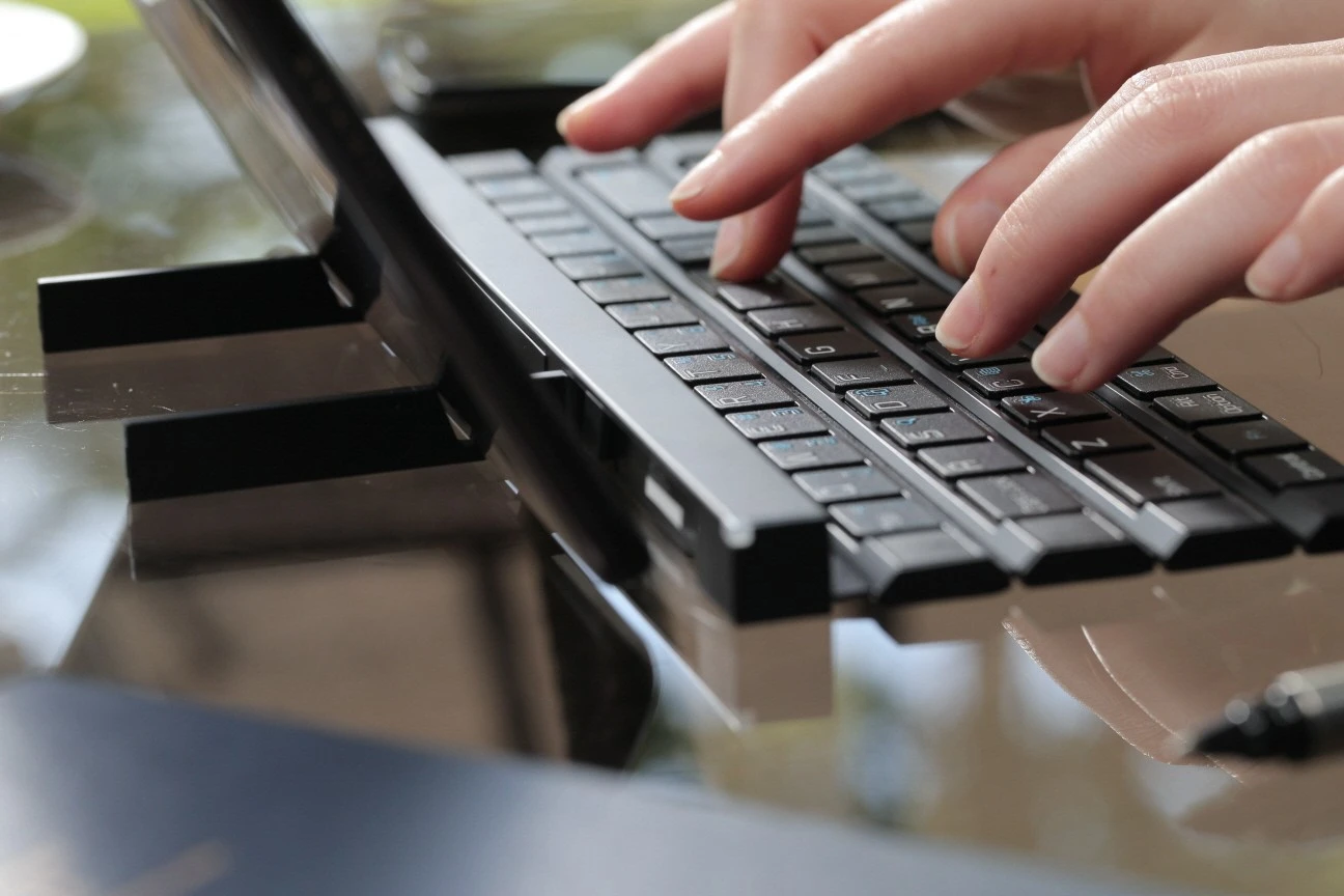 LG's Rolly Keyboard has two fold-out arms to support a smartphone or tablet