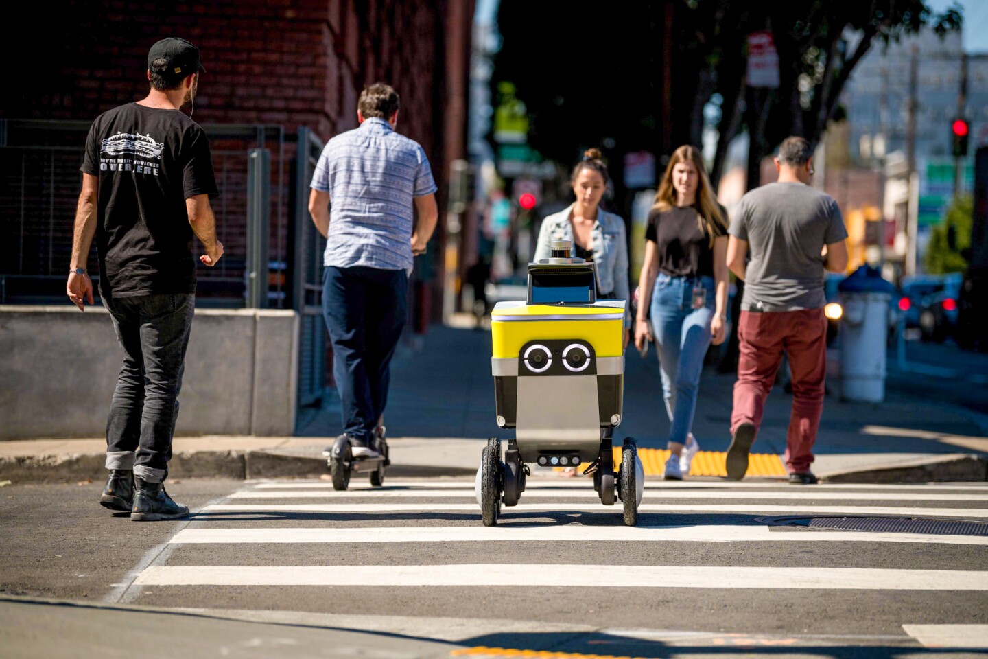 The robots navigate city streets along with other vehicles and pedestrians