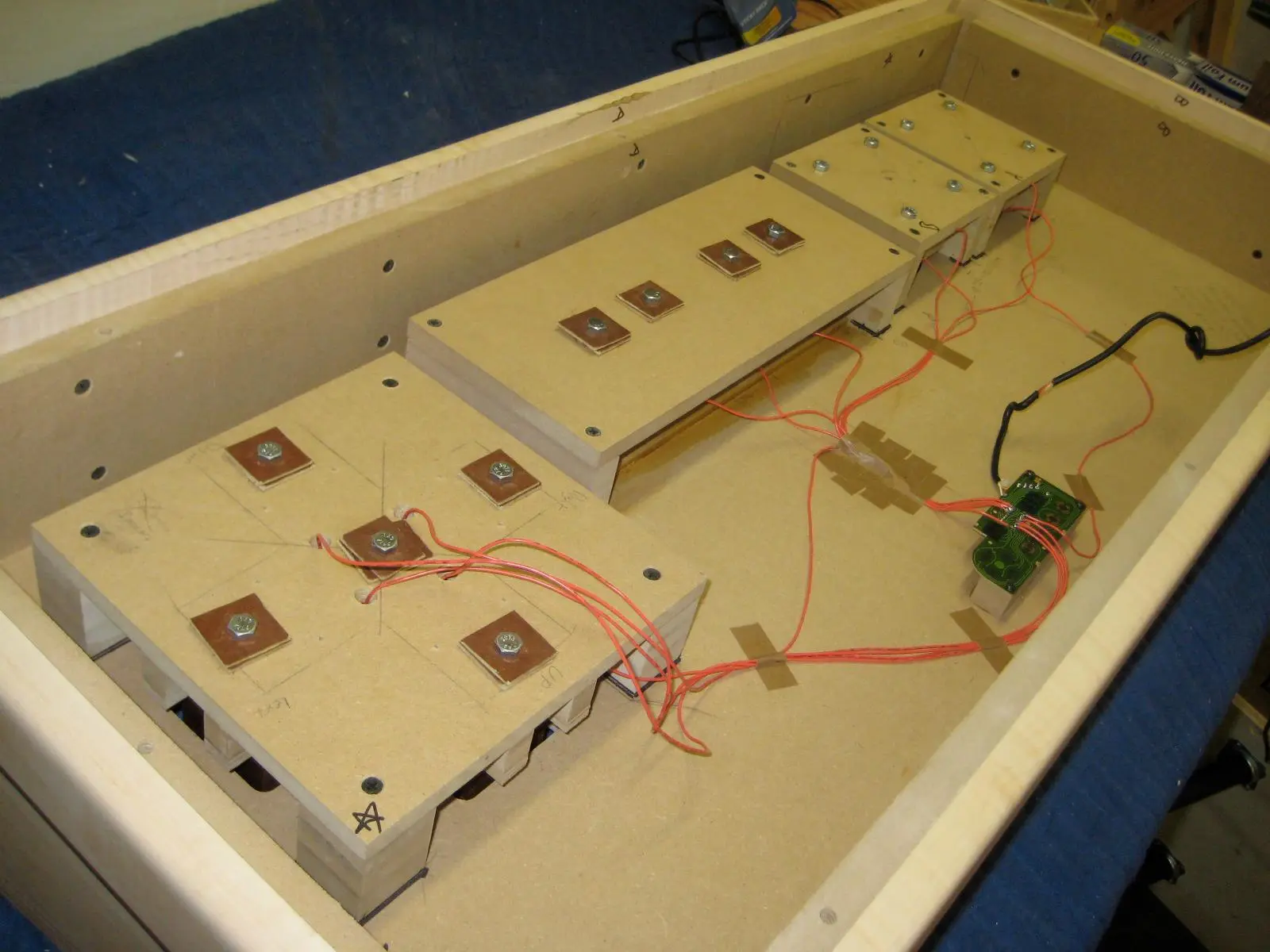 The normally hidden hardware of the Nintendo Controller Coffee Table