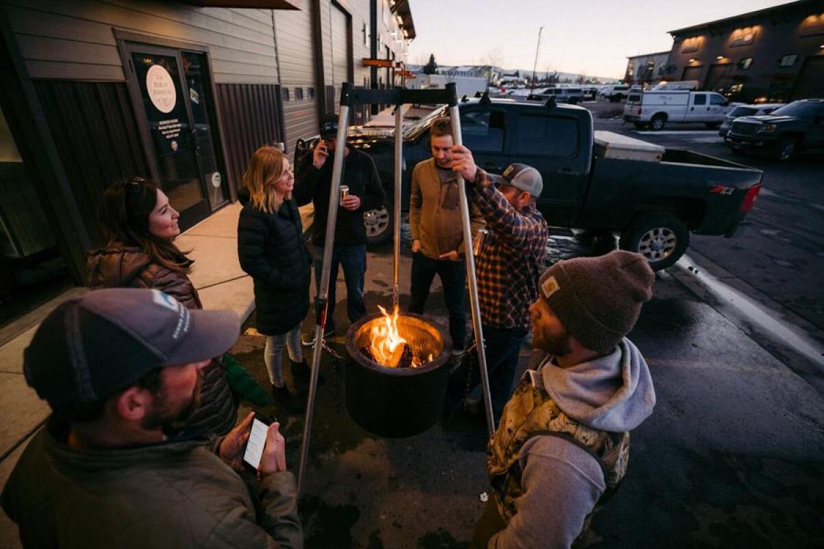 Hanging Burch Barrel Grills Smokes And Keeps You Warm After Dark