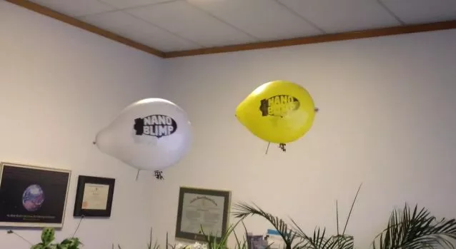 Two Nanoblimps, engaging in aerial warfare in an office