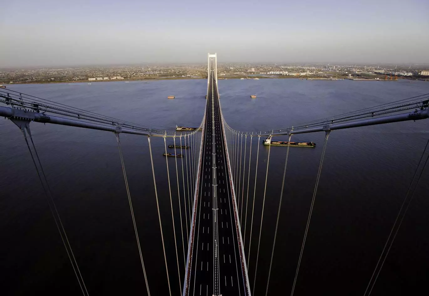 Taizhou Bridge is the first suspension bridge of its type, using two main spans between three support towers