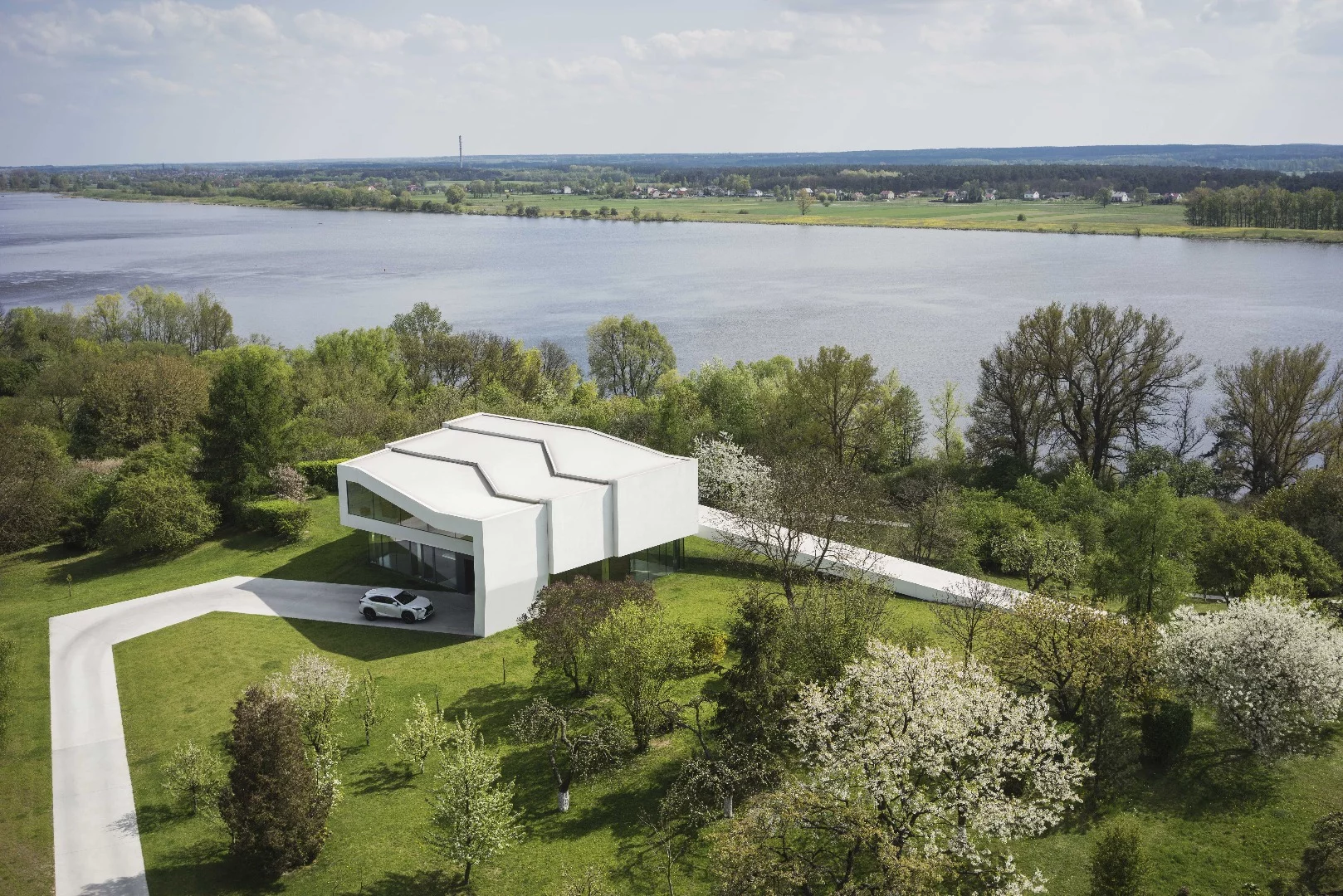 The By The Way House features a first floor wrapped in a singular looping element