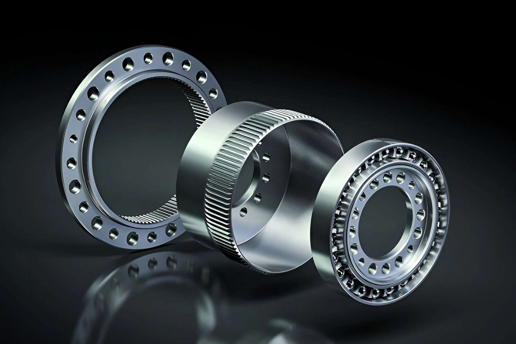 The flexible FlexSpline part in the middle has two less teeth than the outer ring gear