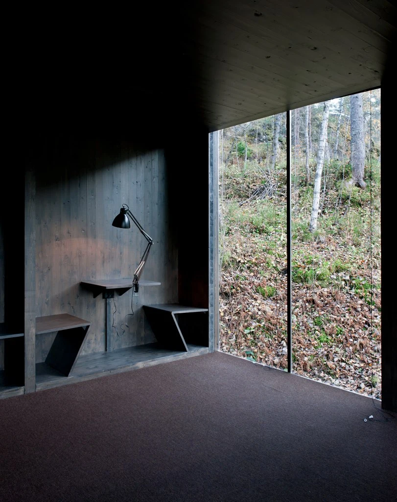 The interior is also dark to avoid taking attention away from the scenery