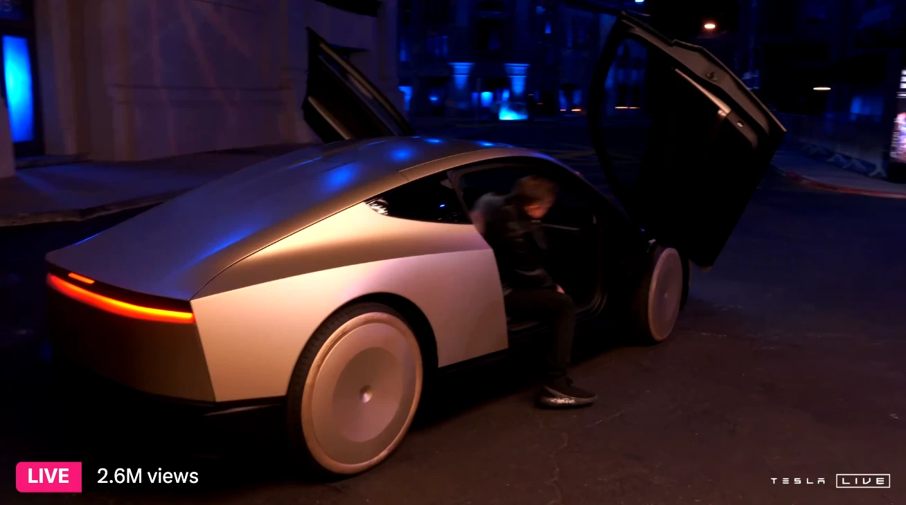 Elon Musk jumps straight in the Robotaxi to start the event