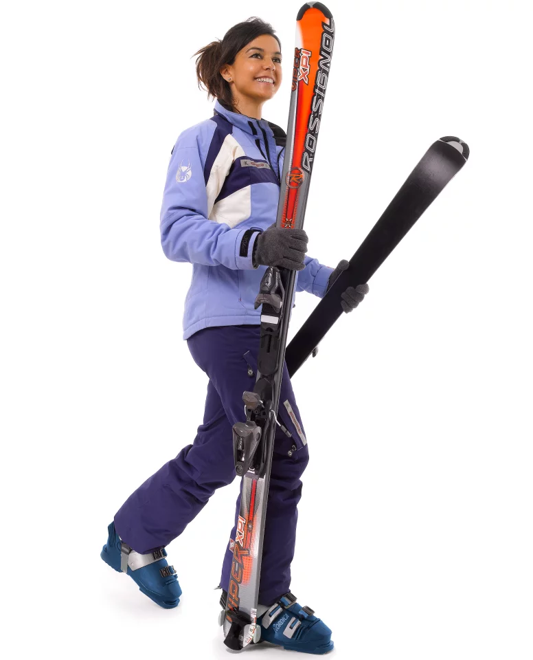 The user just walks while holding onto the tops of the skis, which scissor along on either side of them