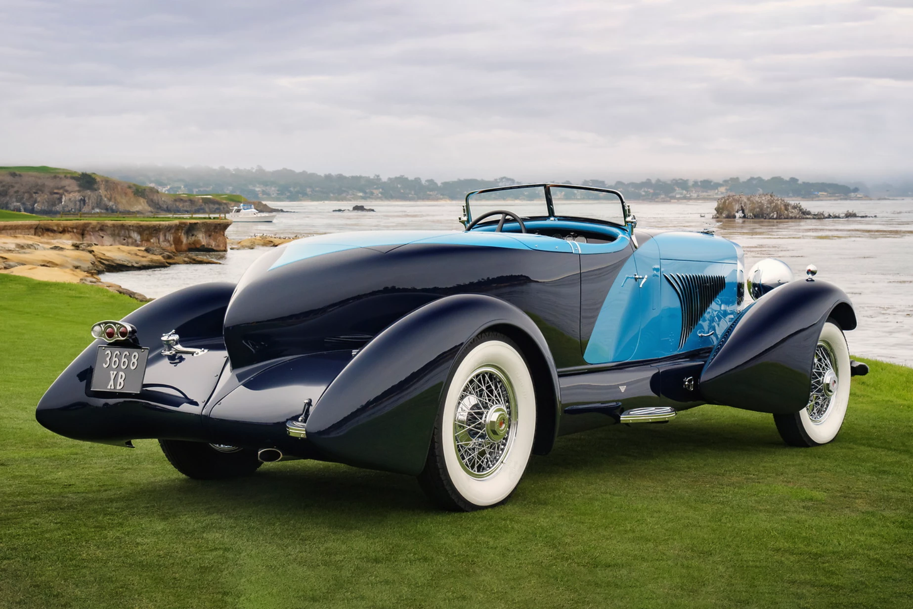 The winning 1932 Duesenberg J Figoni Sports Torpedo was "dressed" by Giuseppe Figoni, whose art deco designs during the 1930s made him one of the world's most influential automotive couturiers. This astonishingly beautiful art deco moving sculpture is a "one off" built for a Peruvian sugar baron during the "Great Depression" at massive cost using the Duesenberg Model J chassis and 265-hp, 7-liter, DOHC, 32-valve, straight eight engine. It cost roughly the equivalent of ten times a physician's annual salary at the time.