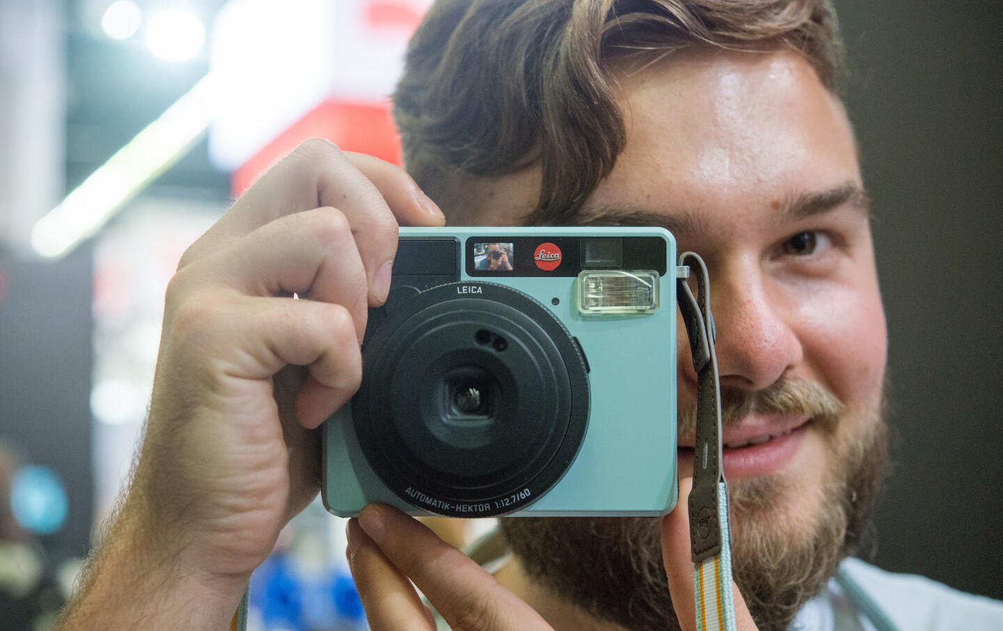 A Leica representative snaps a shot of us with the Sofort instant camera