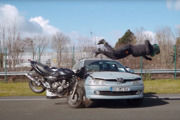 In a truly remarkable product demonstration, a rider wearing airbag pants crashes into a Peugeot at speed and does "the Superman" over the hood