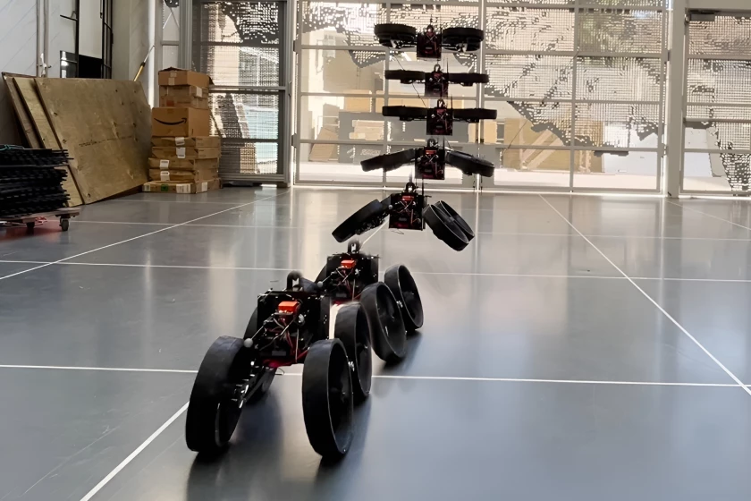 Flying robot morphs mid-air to land and roll on wheels
