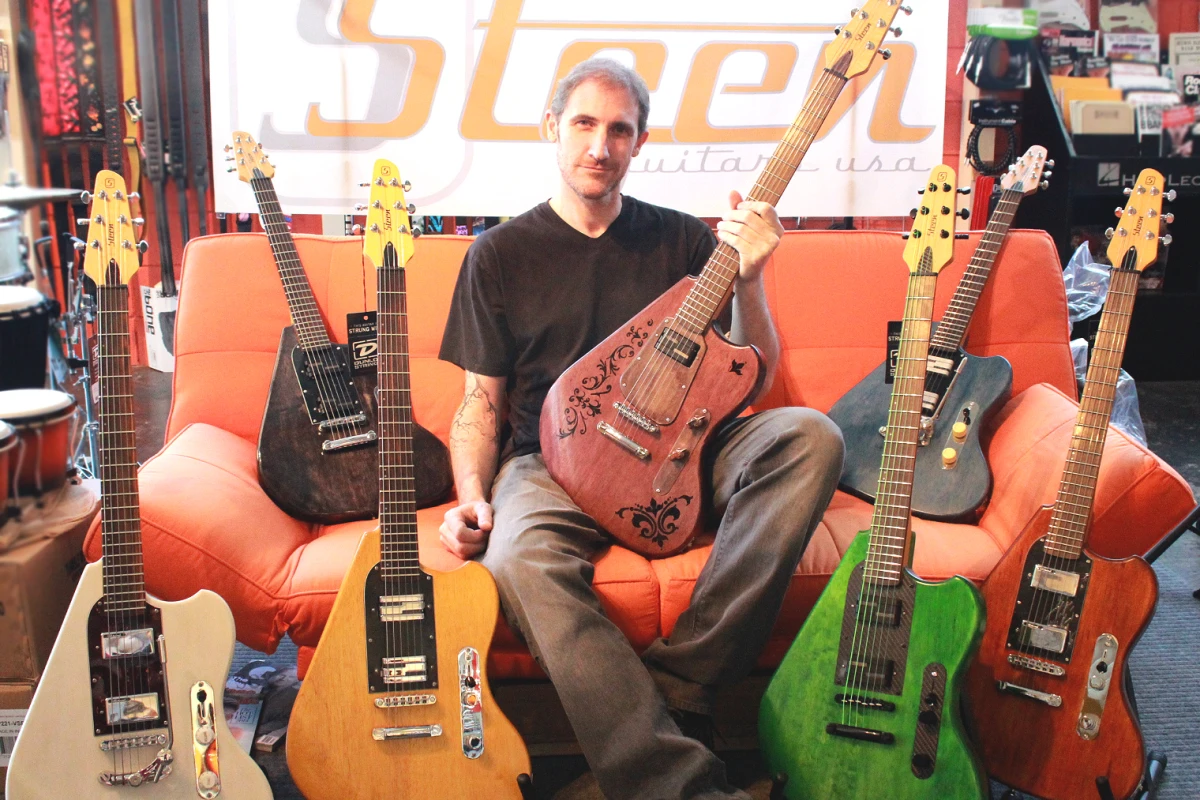 Shawn Steen with his ergonomically-designed guitars
