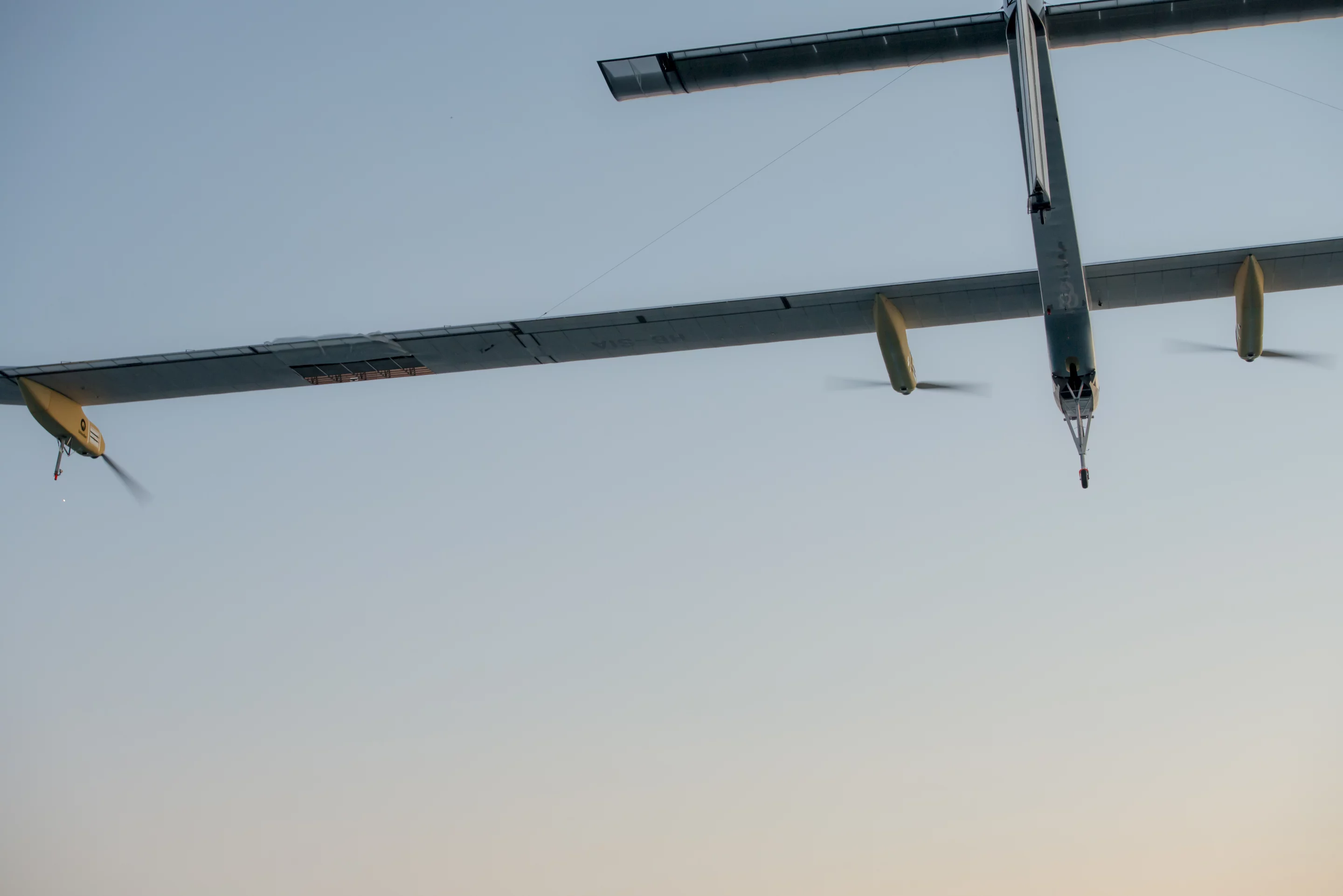 A view from beneath the Solar Impulse on its final flight leg, showing the damage to the left wing's fabric covering (Photo: Solar Eclipse)