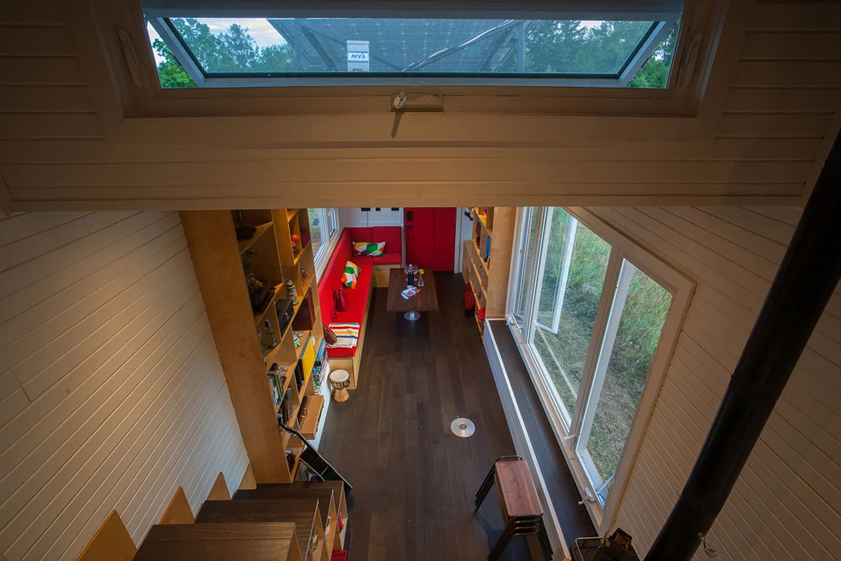 View of the living area from the bedroom in the Greenmoxie Tiny House