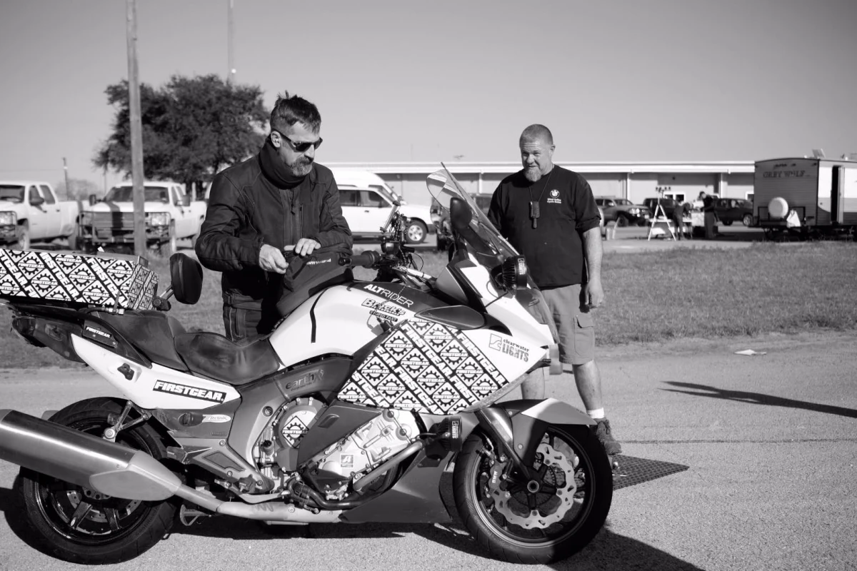 Carl Reese with his BMW on the day he set a Guinness-certified world record for longest distance in a single day