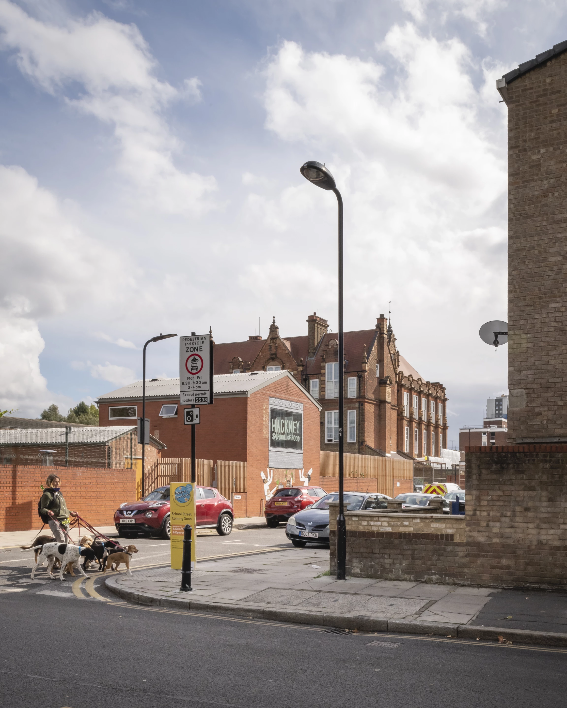 The Hackney School of Food's exterior is largely unchanged from its time as a former house, though it does feature some artwork and the addition of a new fence