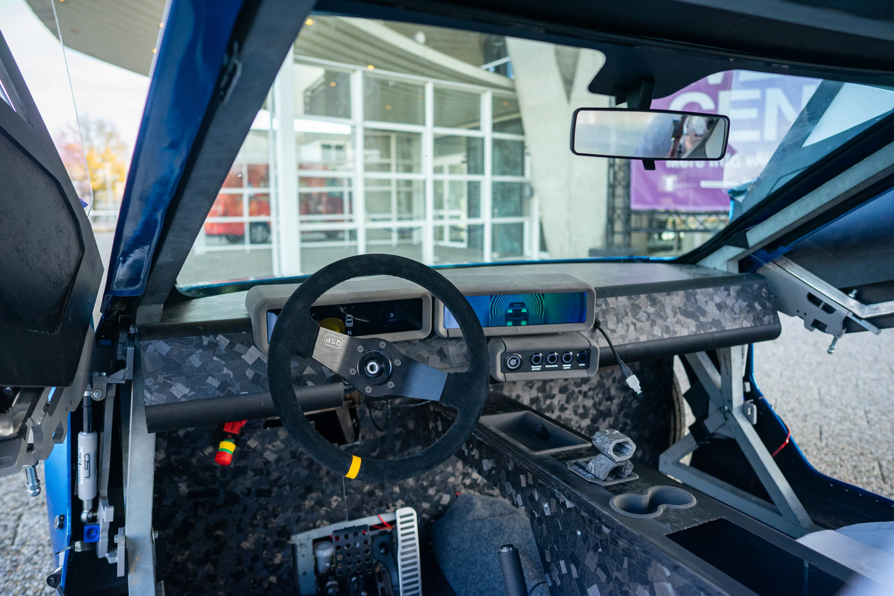 ARIA's interior ain't pretty, but all the basics are there - including a digital instrument cluster, system controls and even trays and cup holders