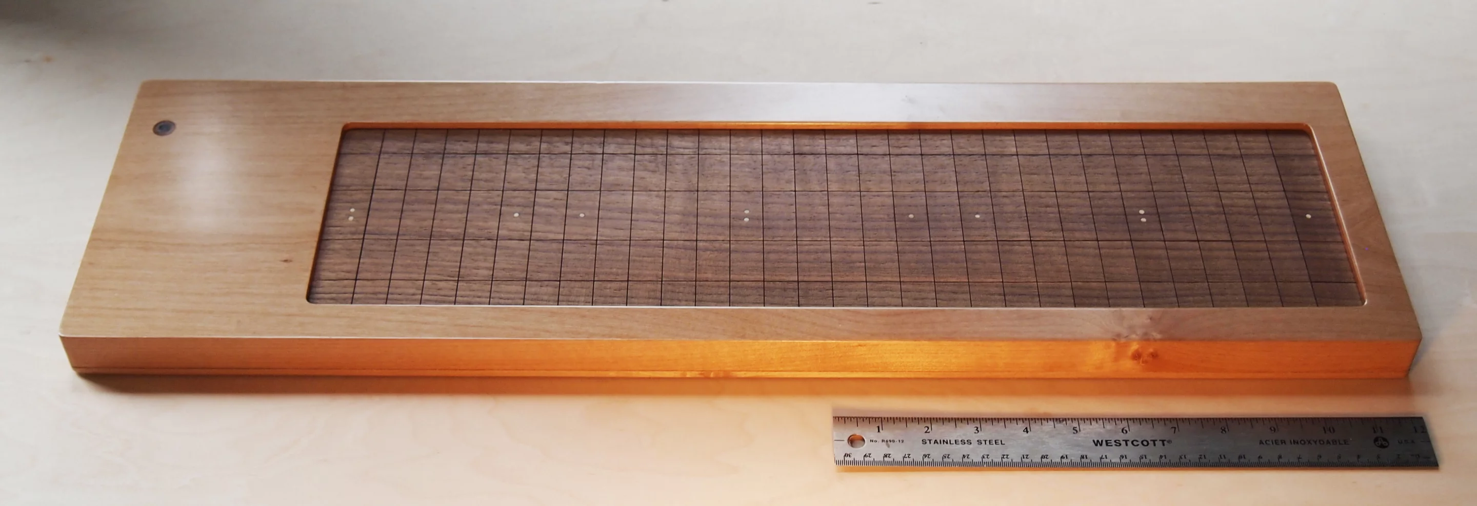 The Soundplane Model A computer music controller can be played using fingers, mallets, sticks or anything that applies force to the keys