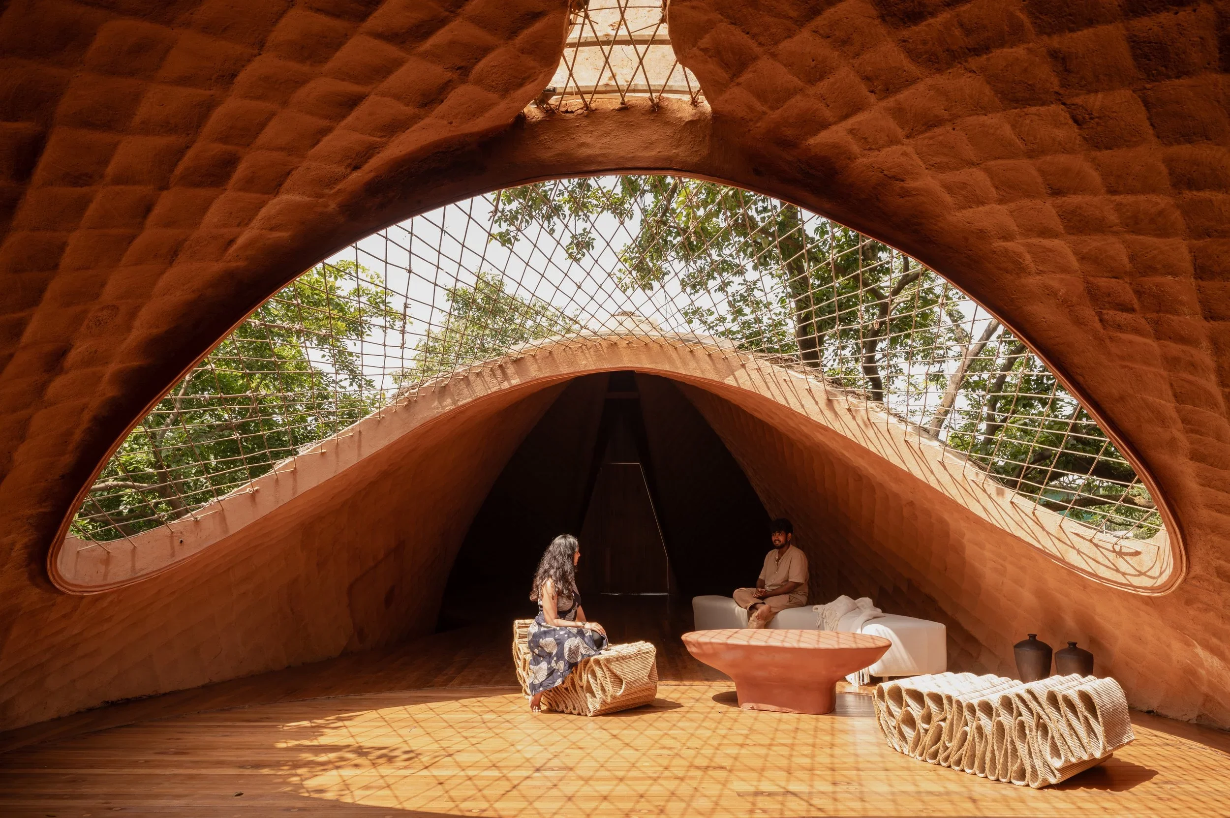 The Bridge House "has an open layout with an oculus in the center that acts as a courtyard through which the sky and rain can be enjoyed"