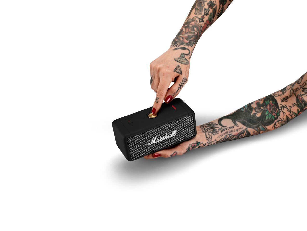 Playback is controlled using a multi-directional knob up top