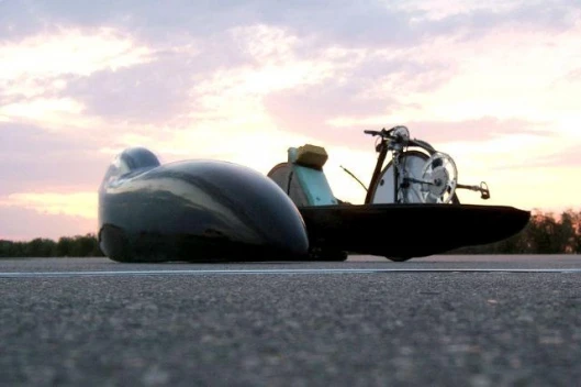 The bike with the fairing sitting beside it