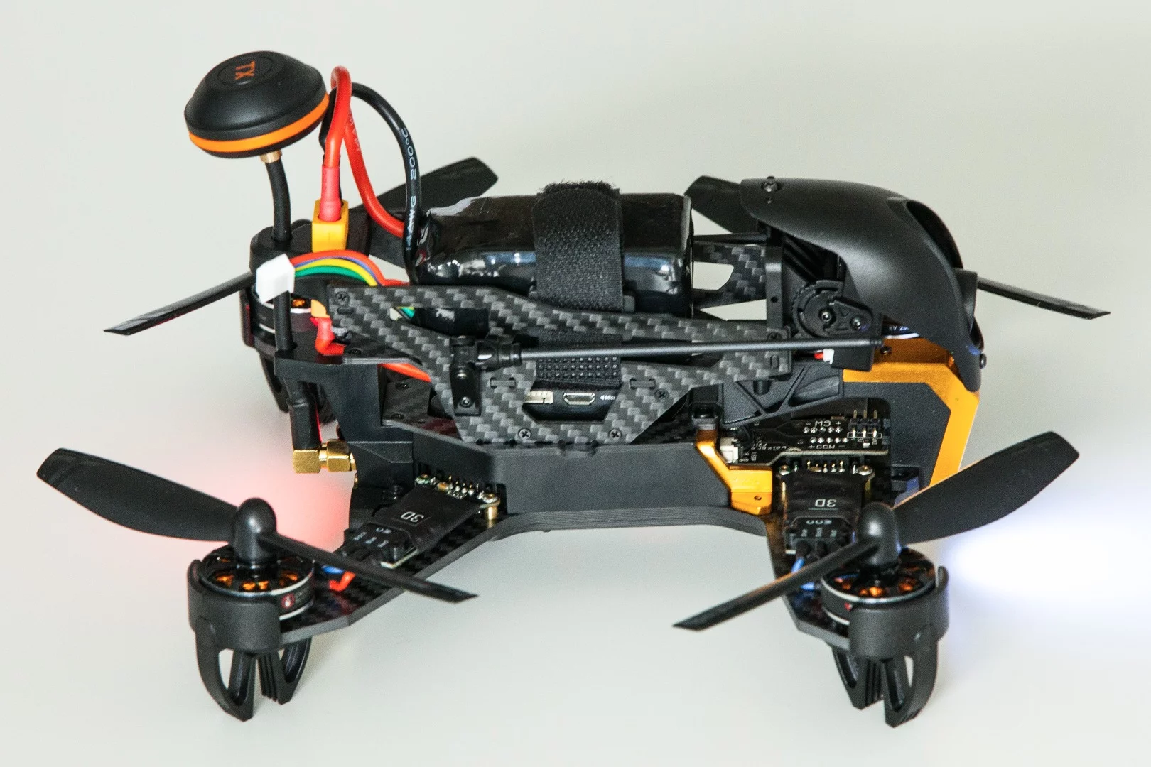 Walkera F210 3D: transmitter blob sits on a flexible mount, letting it fold out of the way in a crash.